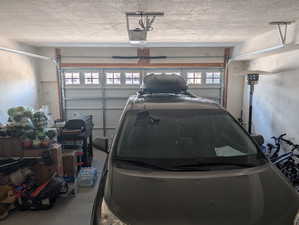 Garage featuring a garage door opener