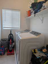 Washroom featuring separate washer and dryer