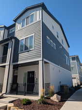 View of home's exterior featuring board and batten siding and covered porch