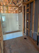 Full bath featuring shower / bath combination