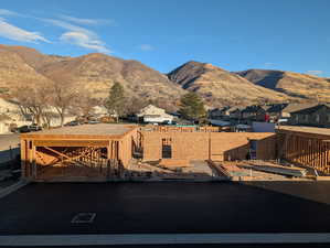 View of mountain backdrop with nearby suburban area
