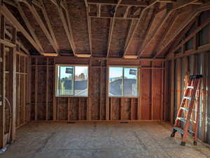 Miscellaneous room with lofted ceiling