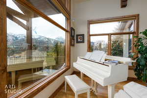 Sitting room featuring a mountain view and wood finished floors