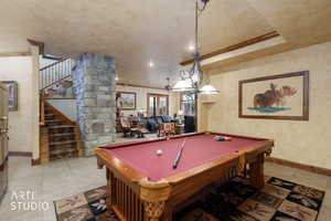 Game room with ornamental molding, billiards table, ornate columns, light tile patterned floors, and recessed lighting