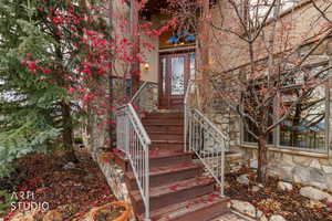 Property entrance featuring stone siding