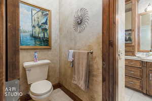 Bathroom featuring light tile patterned floors and vanity