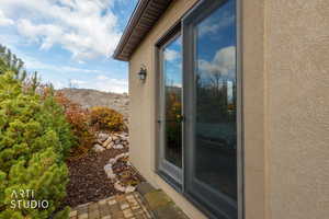 Property entrance with stucco siding