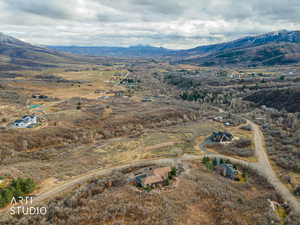 Aerial view of sparsely populated area with a mountainous background