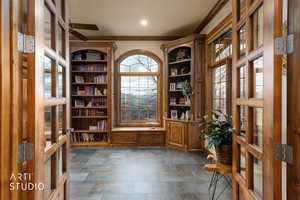 Unfurnished office with french doors, crown molding, and ceiling fan