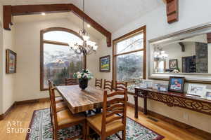 Dining space with a chandelier and light wood finished floors