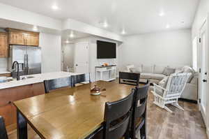 Dining room featuring light wood-style floors and recessed lighting