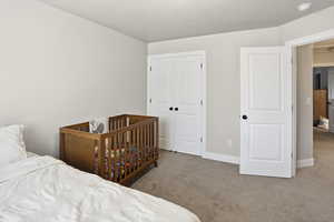 Bedroom with carpet flooring and a closet