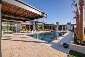 Outdoor pool with a patio