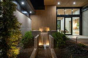 Doorway to property featuring a patio area