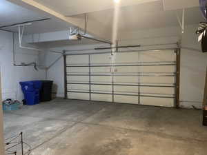Garage featuring a garage door opener