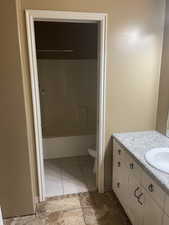 Full bathroom featuring vanity and  shower combination