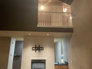 Unfurnished living room featuring a fireplace and recessed lighting