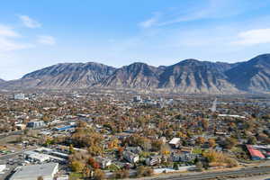 View of mountain background featuring nearby suburban area