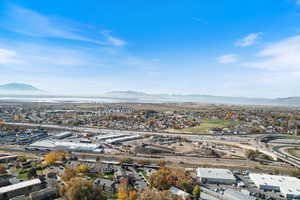 Drone / aerial view of a mountain backdrop and a major roadway