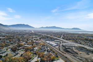 Drone / aerial view of a mountain backdrop and a main thoroughfare