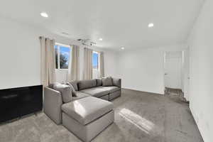Living room featuring carpet flooring and recessed lighting
