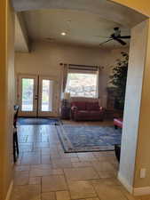 Entrance foyer featuring french doors, stone tile flooring, recessed lighting, and a ceiling fan