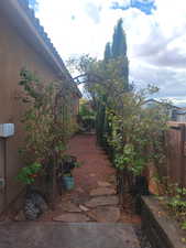 View of patio featuring a gate