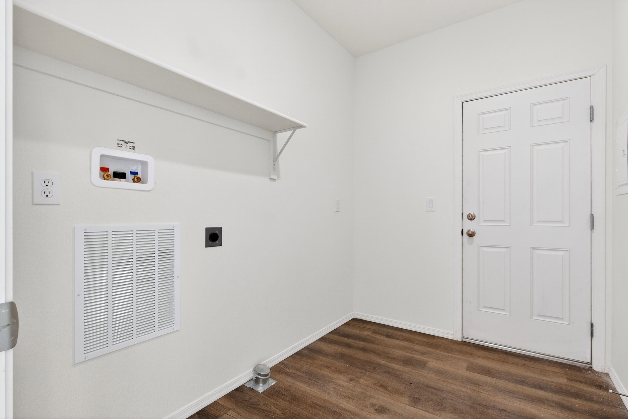 Laundry room featuring hookup for a washing machine, dark wood-style floors, and electric dryer hookup