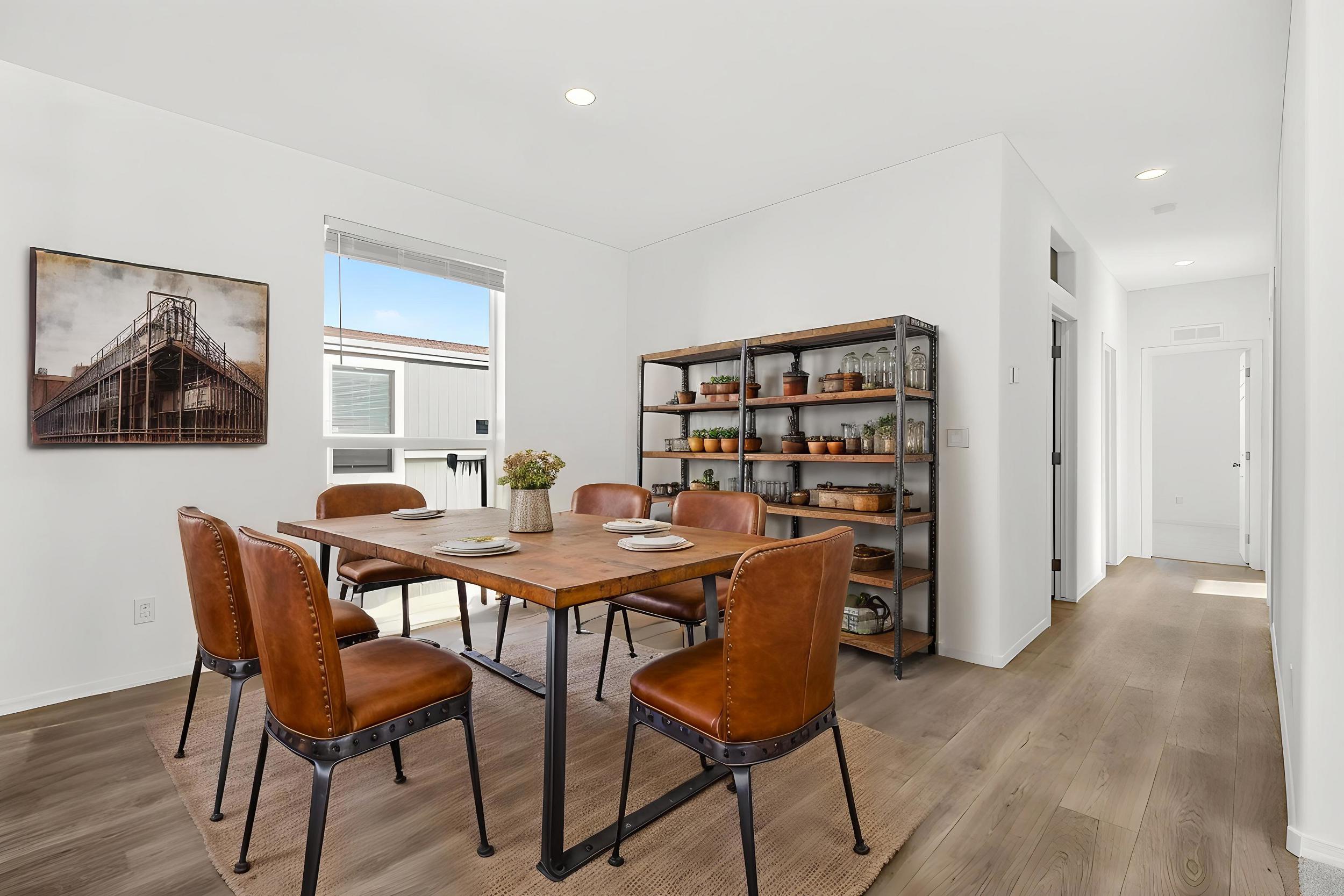 *Virtually staged* Dining space featuring light wood-type flooring and recessed lighting