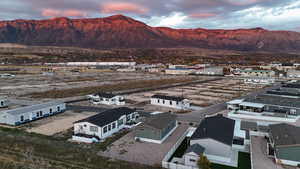 Aerial perspective of suburban area featuring a mountain backdrop