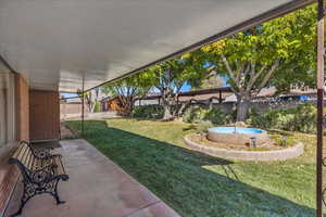 Fenced backyard with a patio area and a swimming pool