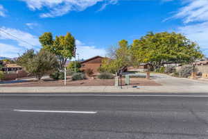 Obstructed view of property with concrete driveway