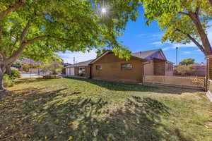 Back of house featuring brick siding and an attached garage