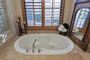 Full bath with a jetted tub