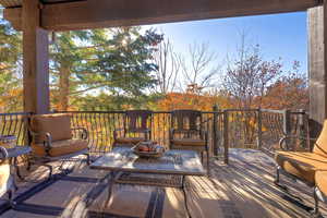 Wooden terrace featuring an outdoor living space