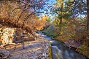 View of patio / terrace with a water view