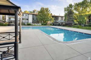 Community pool with a gazebo and a patio area