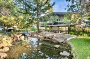 View of property's community with a lawn