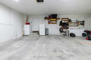 Garage with freestanding refrigerator