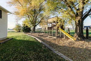 Community jungle gym featuring a yard