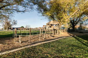 Community jungle gym featuring a yard