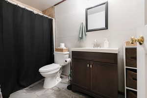 Full bathroom with vanity and a shower with curtain
