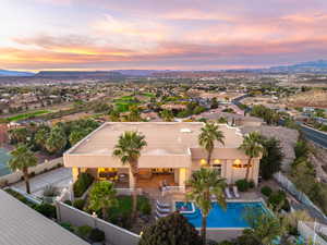 Bird's eye view of mountains and a pool area