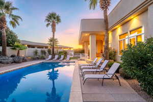 View of pool with a patio and a fenced backyard