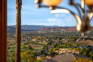 View of mountain background featuring nearby suburban area