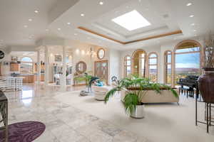 Common area with a high ceiling and recessed lighting