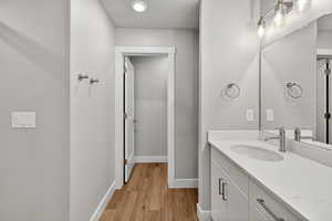 Bathroom with vanity and light wood-style flooring
