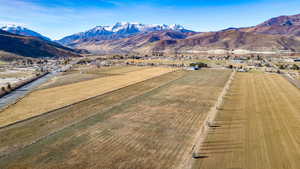 View of mountain backdrop featuring rural landscape