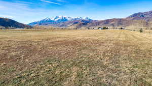 View of mountain backdrop with rural landscape
