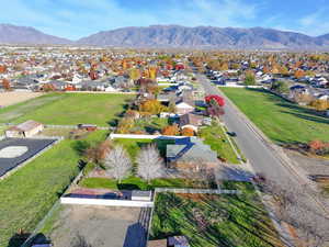 Aerial view of residential area featuring a mountain backdrop